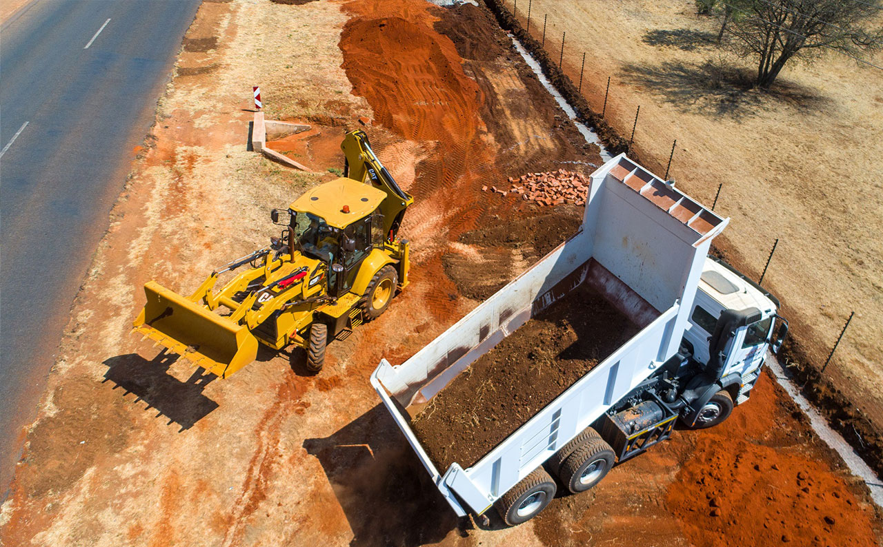 Yellow plant machinery working on a Bucamama Trading site